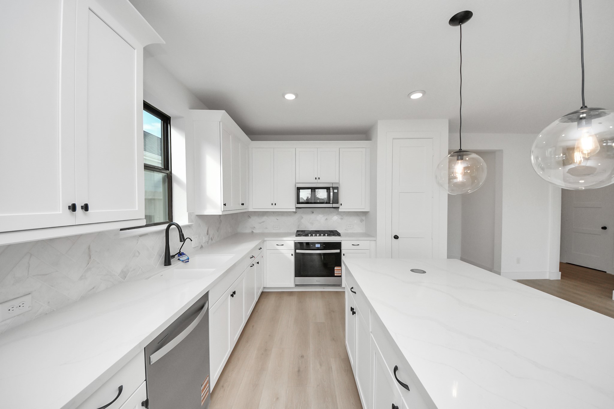 2231 Birch View Lane Katy, TX 77494 - Photo 14 of 40 a large kitchen with stainless steel appliances lots of counter space and a sink