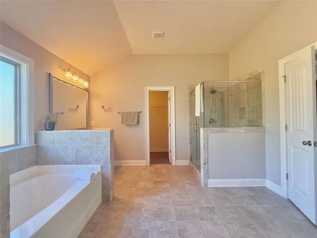 a living room with furniture and a walk in closet