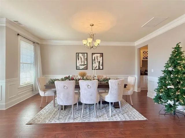 a view of a dining room with furniture and window