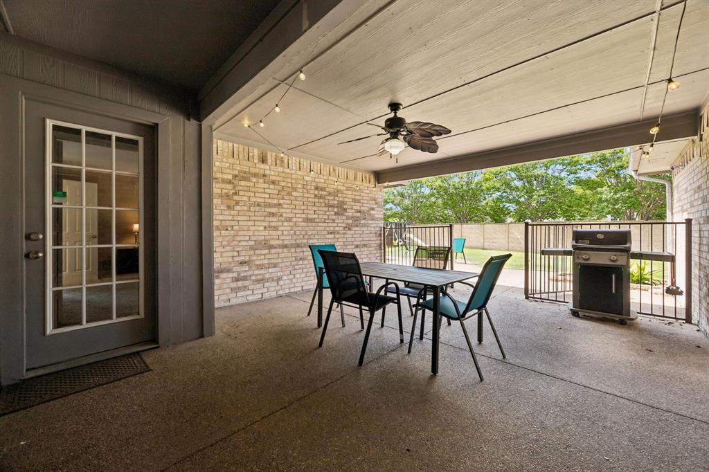 545 Rothschild Lane Murphy, TX 75094 - Photo 24 of 27 Large covered patio wrought-iron gate and ceiling fan.