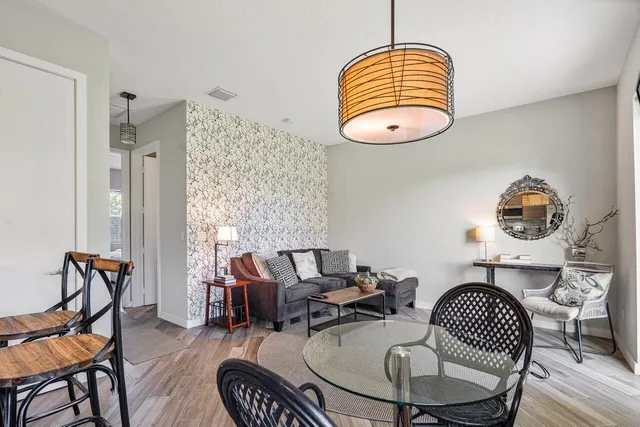 a bedroom with two beds and a television