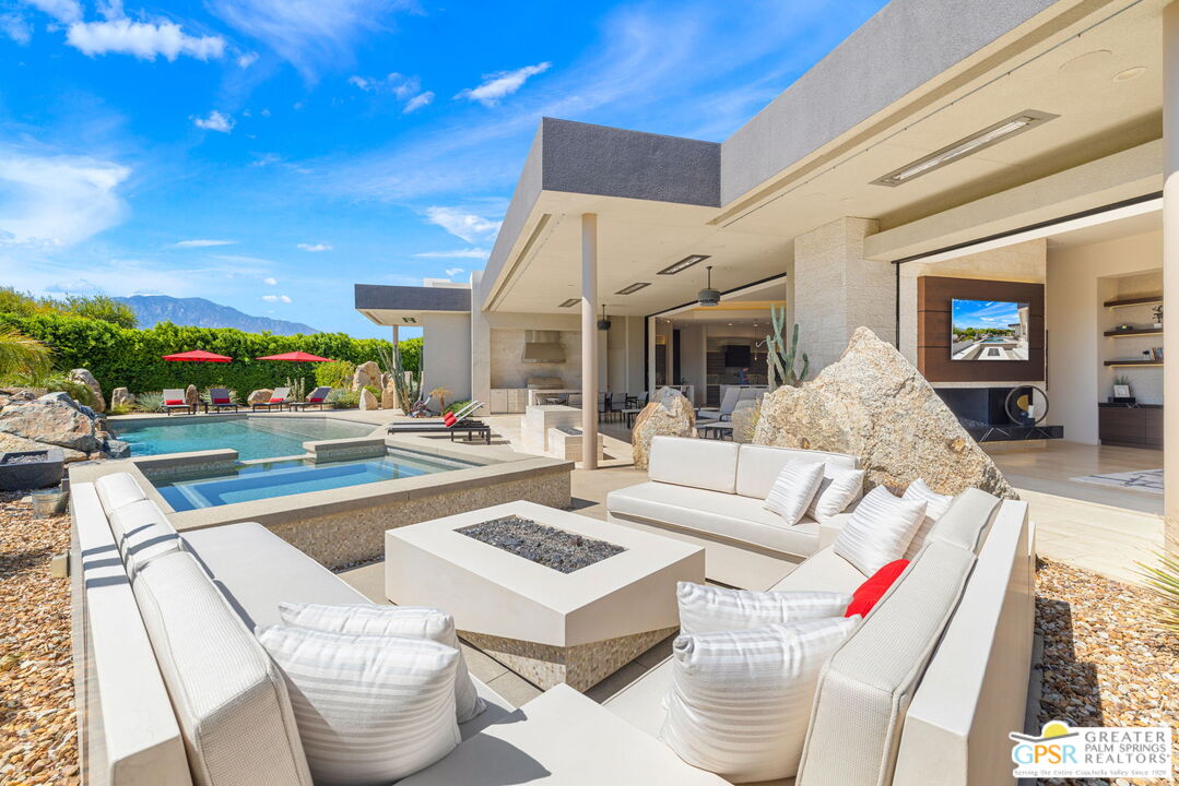 a outdoor space with patio the couches and a potted plant