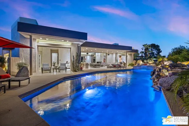 a view of living room with furniture and a flat screen tv