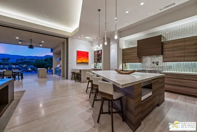 a bathroom with a sink a large mirror and a bathtub