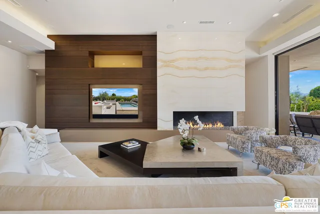 a room with furniture and a chandelier