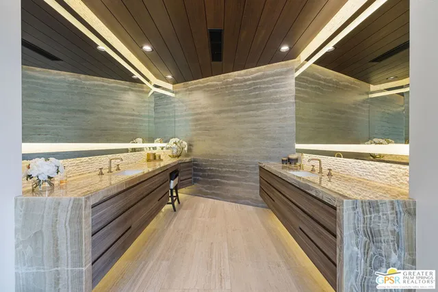 a view of a two chairs in the backyard