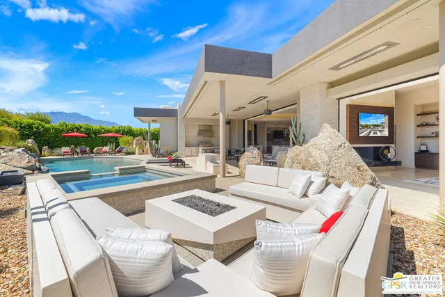 a spacious bedroom with a bed and large window