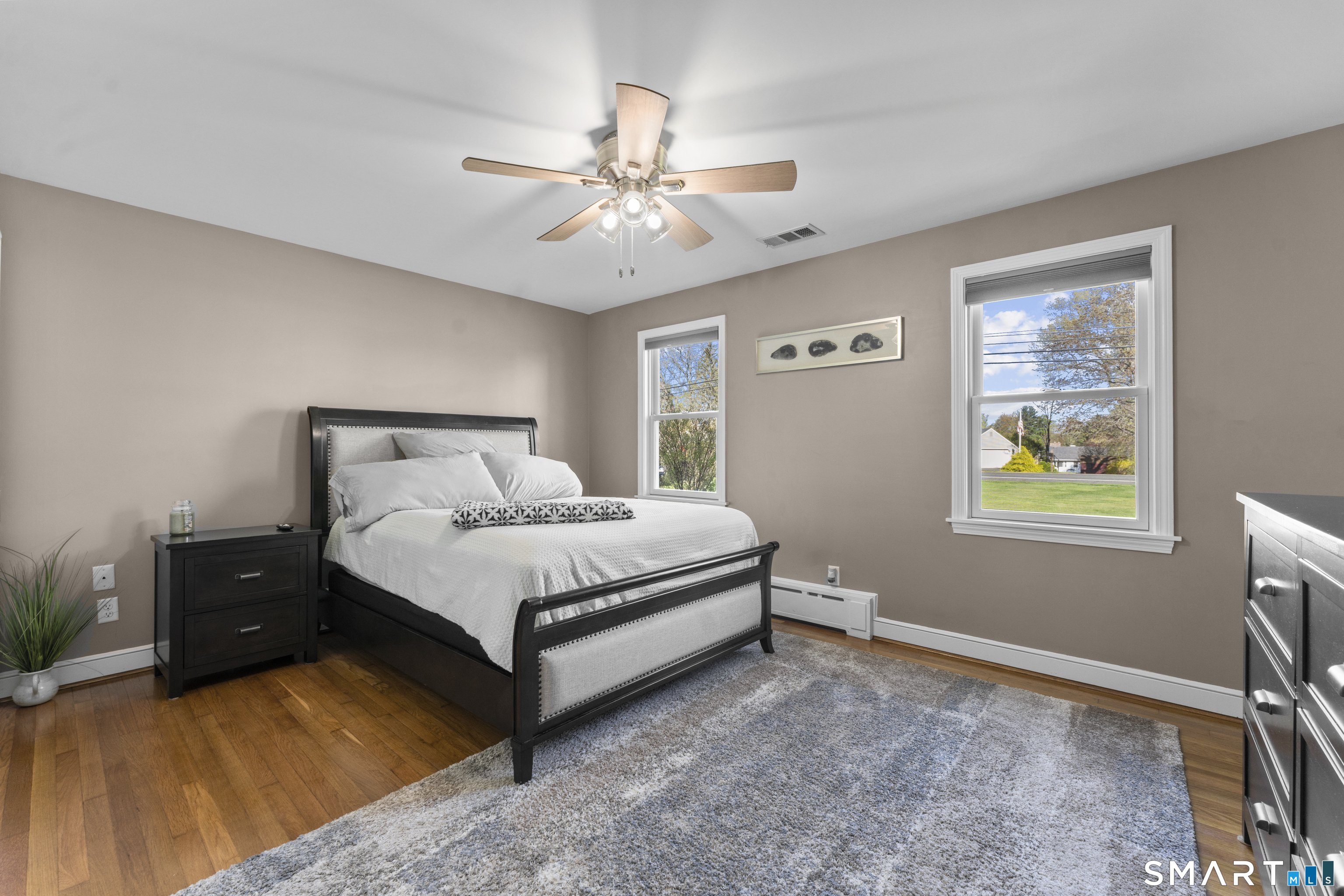 1253 North Street Suffield, CT 06078 - Photo 12 of 33 a bed sitting in a bedroom next to a window