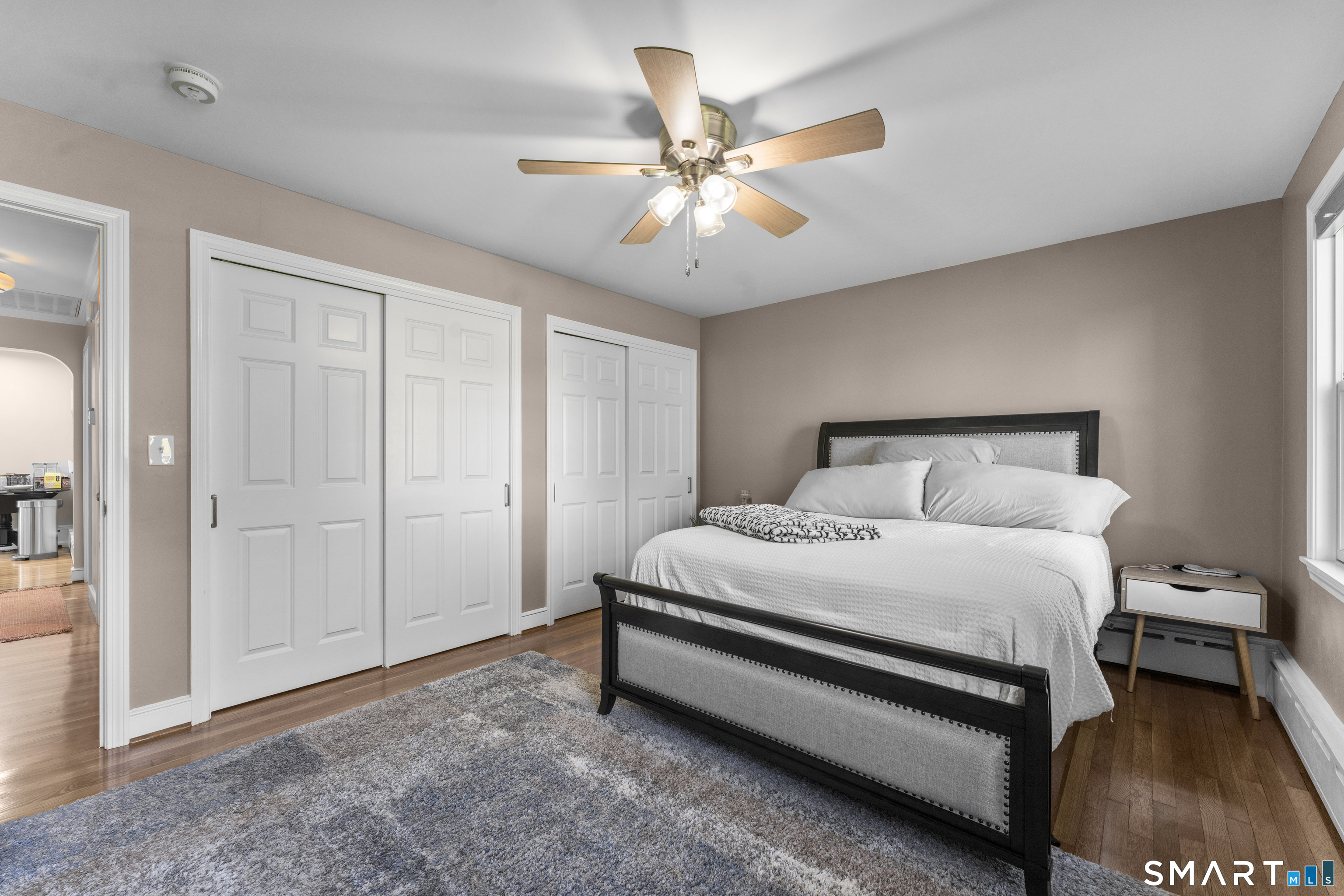 1253 North Street Suffield, CT 06078 - Photo 13 of 33 a bedroom with a bed and a chandelier