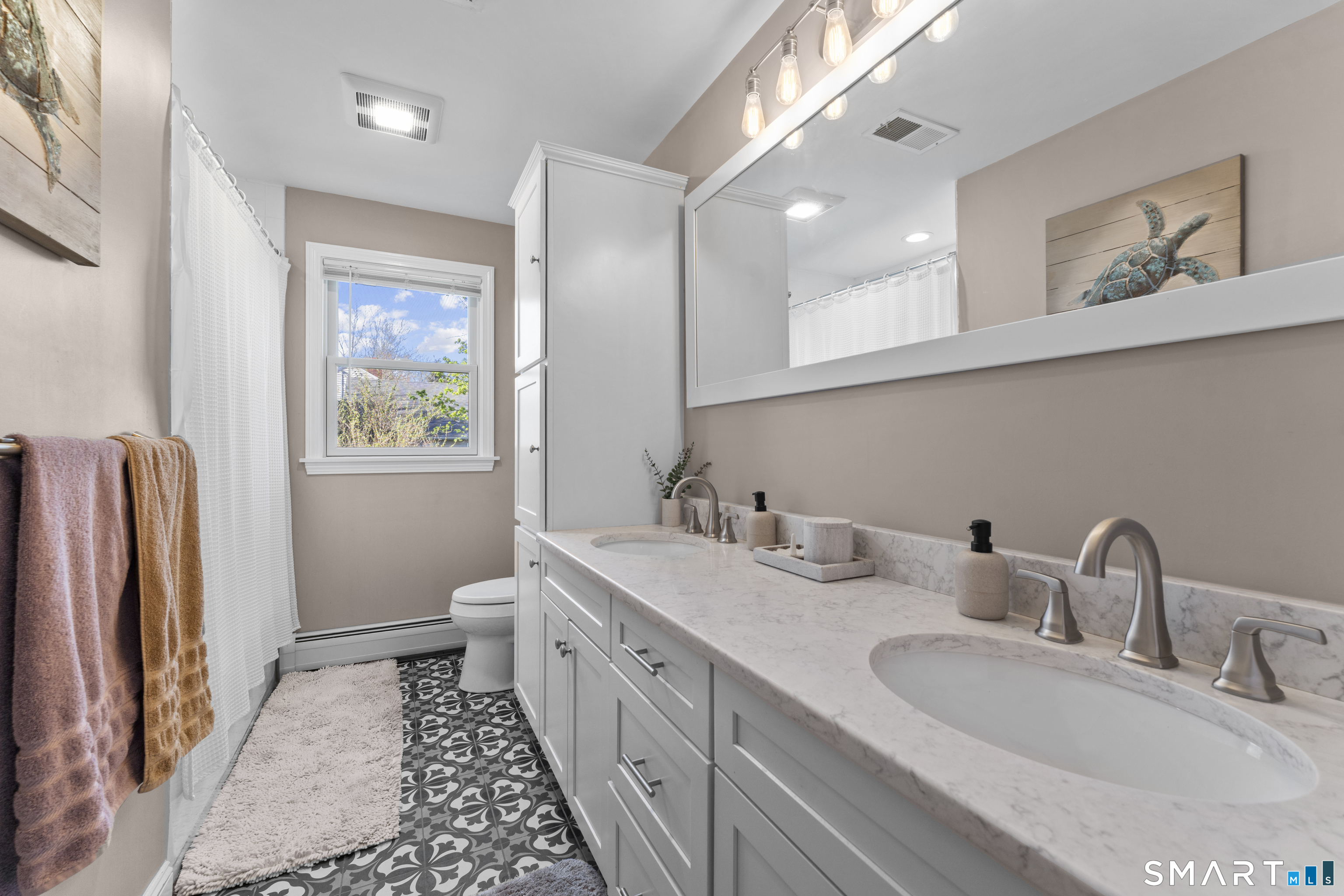 1253 North Street Suffield, CT 06078 - Photo 14 of 33 a bathroom with a double vanity sink and a mirror