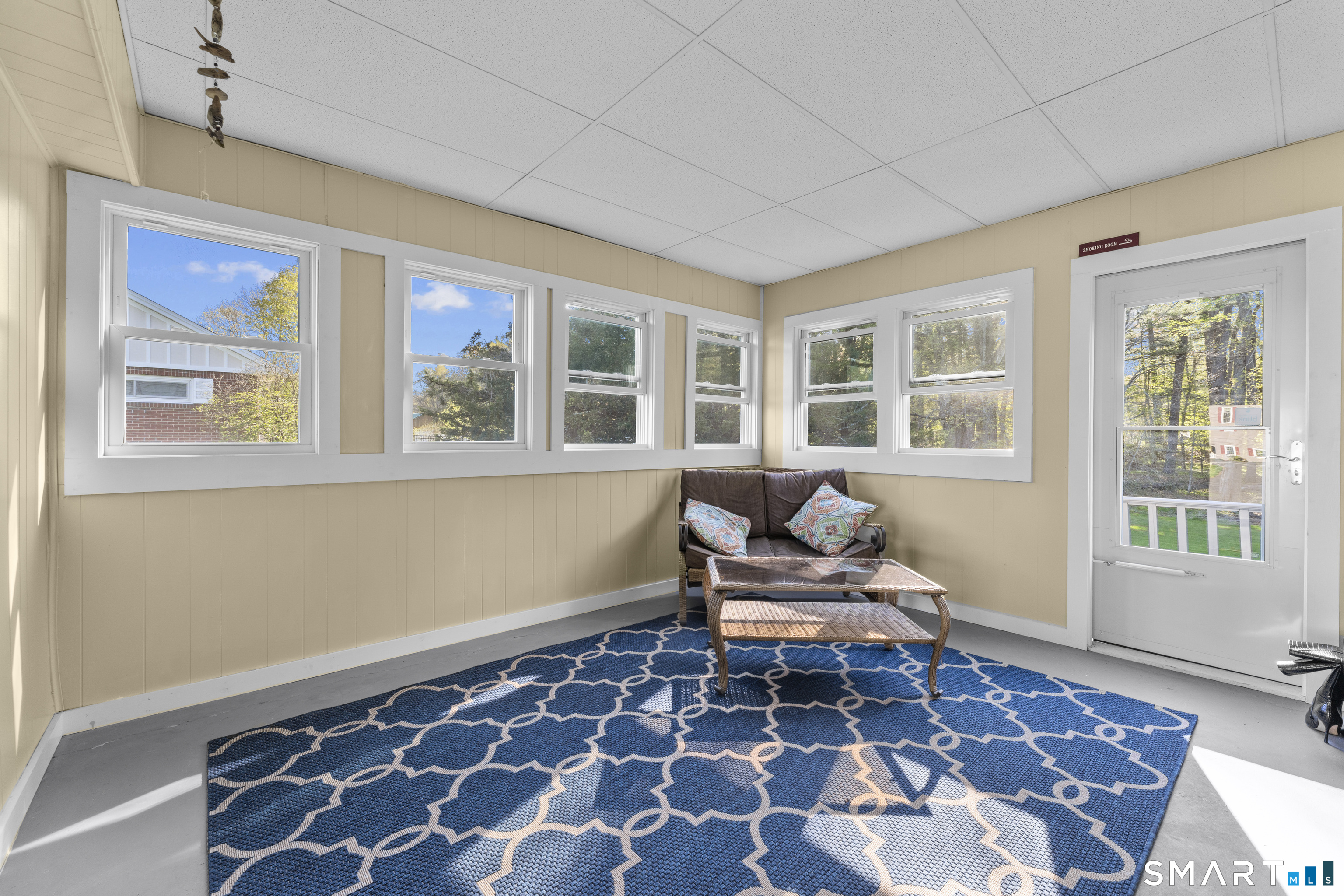 1253 North Street Suffield, CT 06078 - Photo 19 of 33 a living room with a rug and a window