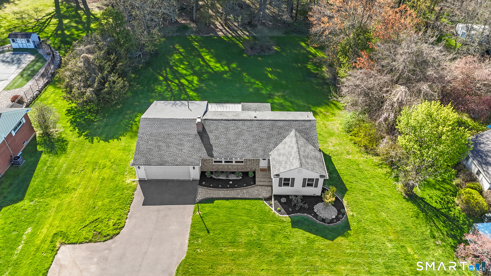 1253 North Street Suffield, CT 06078 - Photo 2 of 33 an aerial view of a house with yard swimming pool and garden