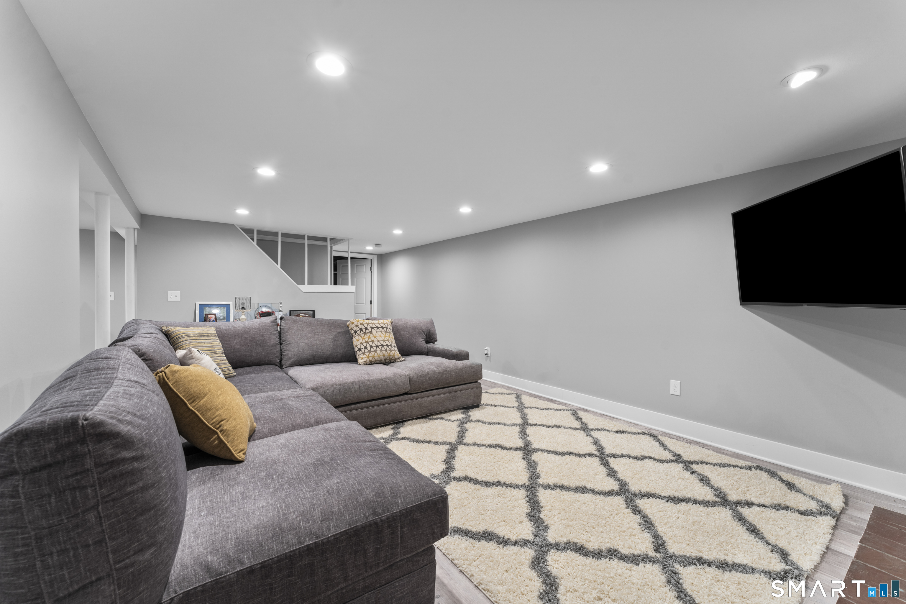 1253 North Street Suffield, CT 06078 - Photo 21 of 33 a living room with furniture and a flat screen tv
