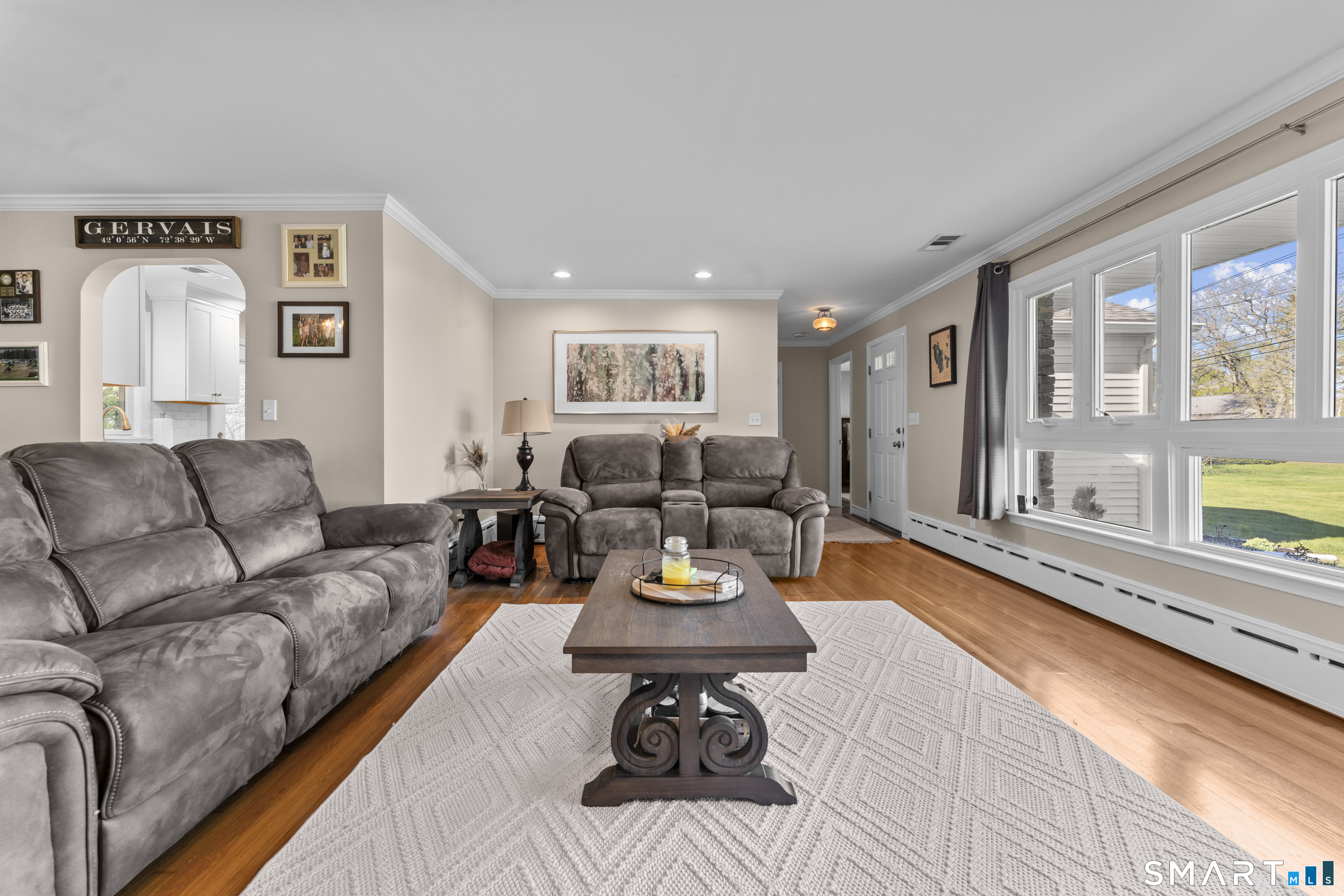 1253 North Street Suffield, CT 06078 - Photo 6 of 33 a living room with furniture and a large window