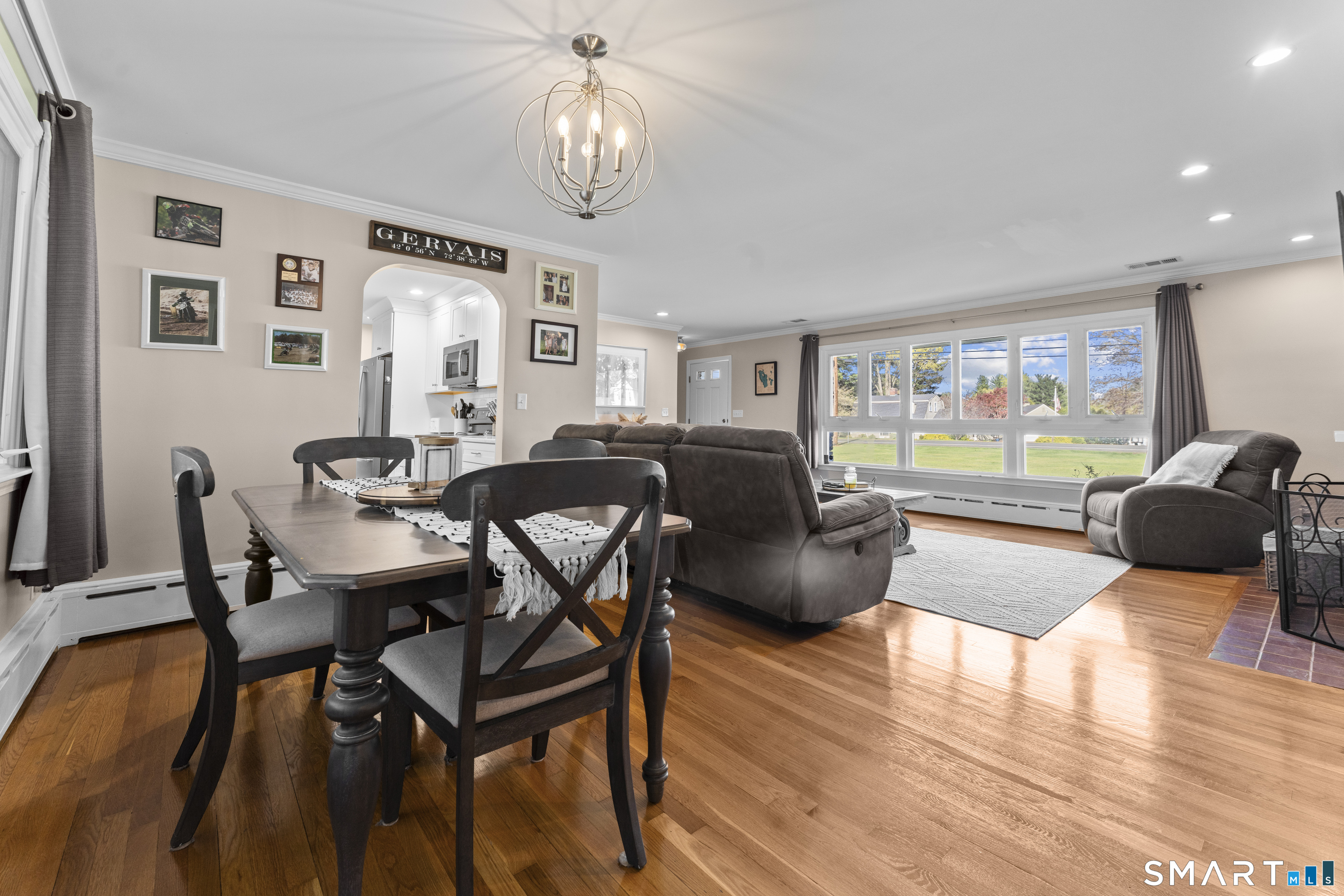 1253 North Street Suffield, CT 06078 - Photo 7 of 33 a living room with furniture potted plant and a large window