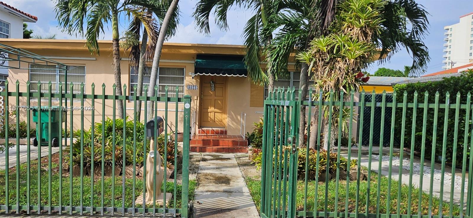 3121 Southwest 23rd Street Miami, FL 33145 - Photo 1 of 31 front view of a house with a garden