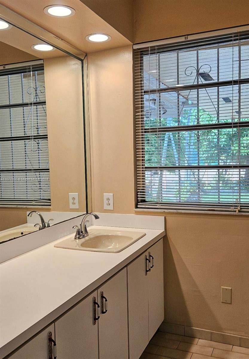 3121 Southwest 23rd Street Miami, FL 33145 - Photo 20 of 31 a bathroom with a sink and a large mirror