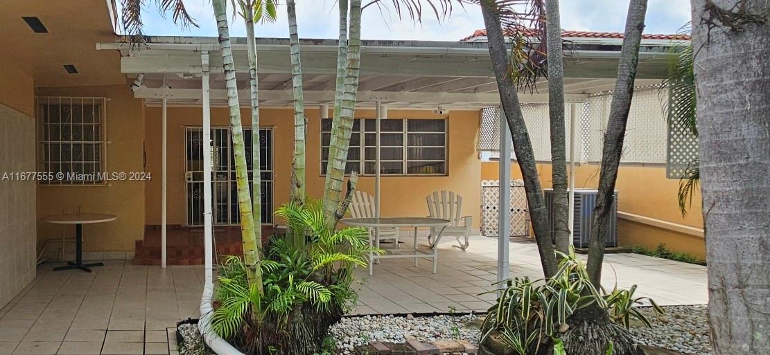 3121 Southwest 23rd Street Miami, FL 33145 - Photo 2 of 31 a potted plant sitting in front of a building