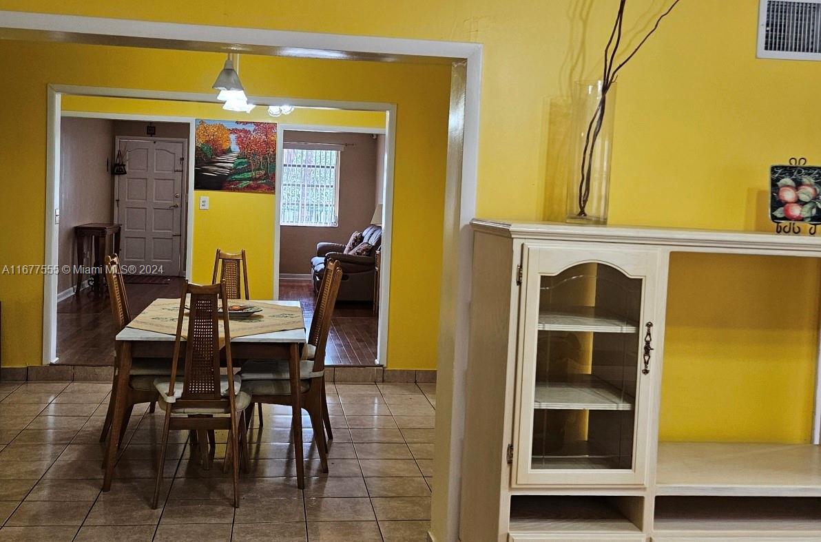 3121 Southwest 23rd Street Miami, FL 33145 - Photo 5 of 31 a view of living room with a table and chairs
