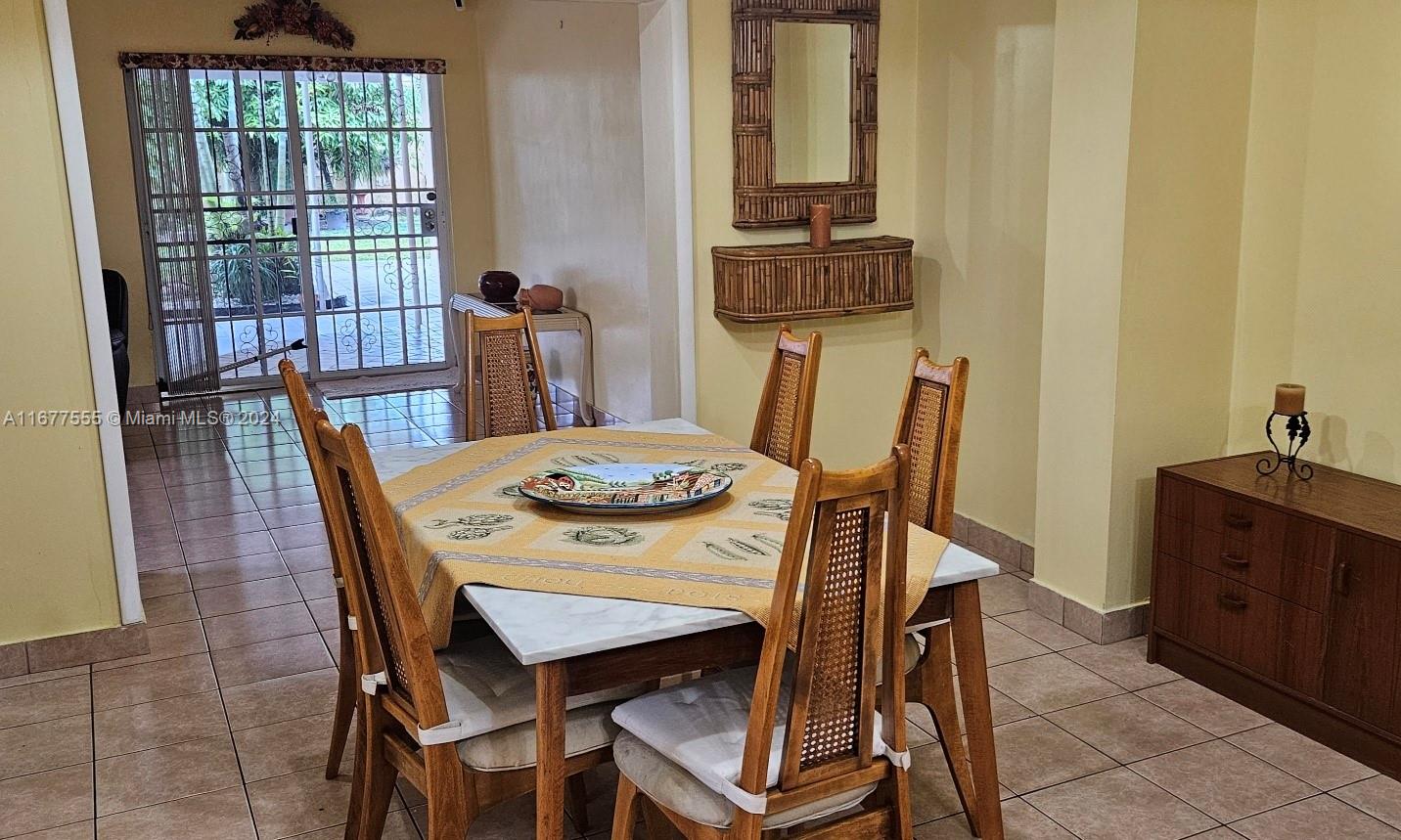3121 Southwest 23rd Street Miami, FL 33145 - Photo 6 of 31 a view of a dining room with furniture and window