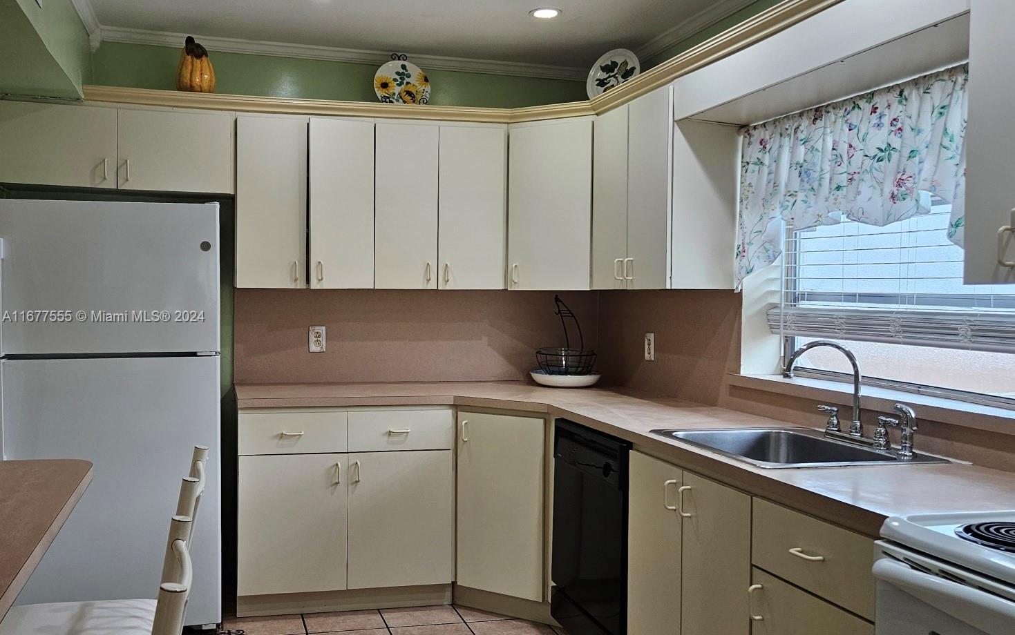 3121 Southwest 23rd Street Miami, FL 33145 - Photo 10 of 31 a kitchen with a sink and cabinets