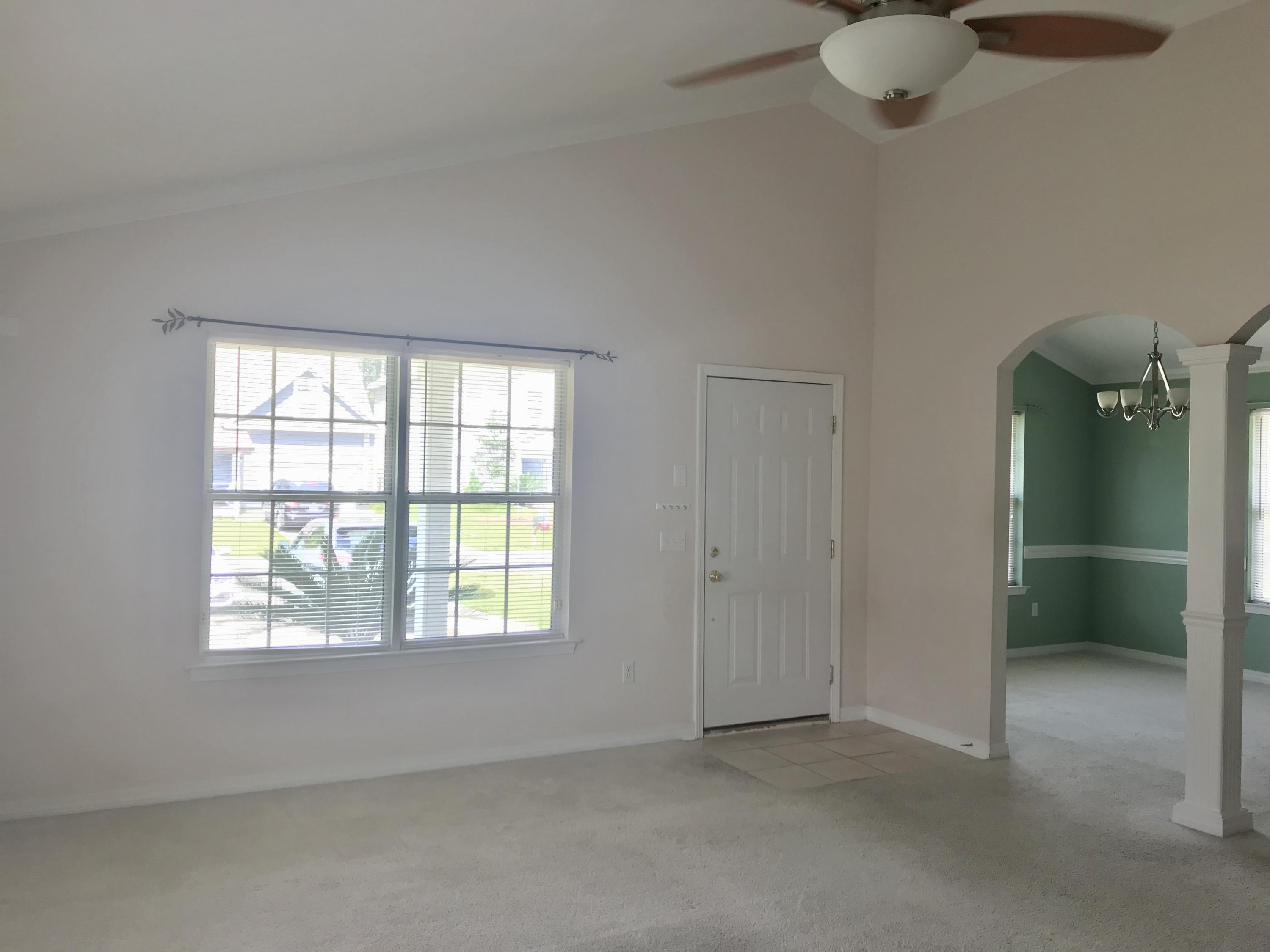 38 4th Street Santa Rosa Beach, FL 32459 - Photo 4 of 22 an empty room with windows