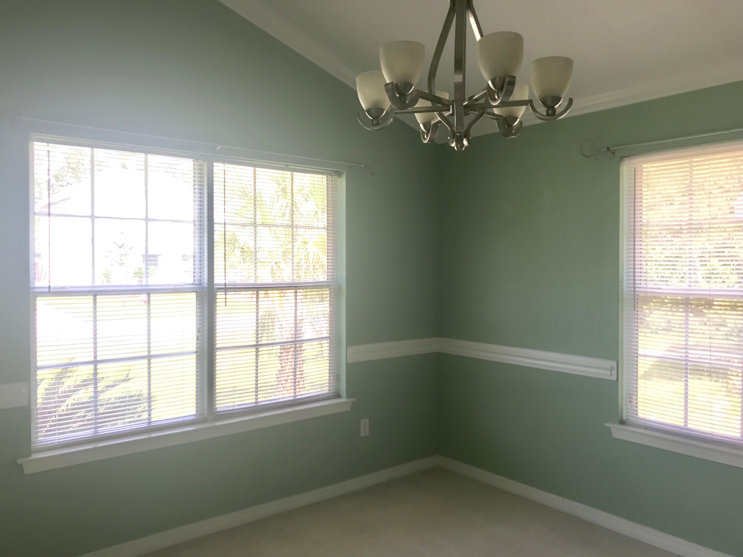 38 4th Street Santa Rosa Beach, FL 32459 - Photo 5 of 22 a room that has a window and a chandelier