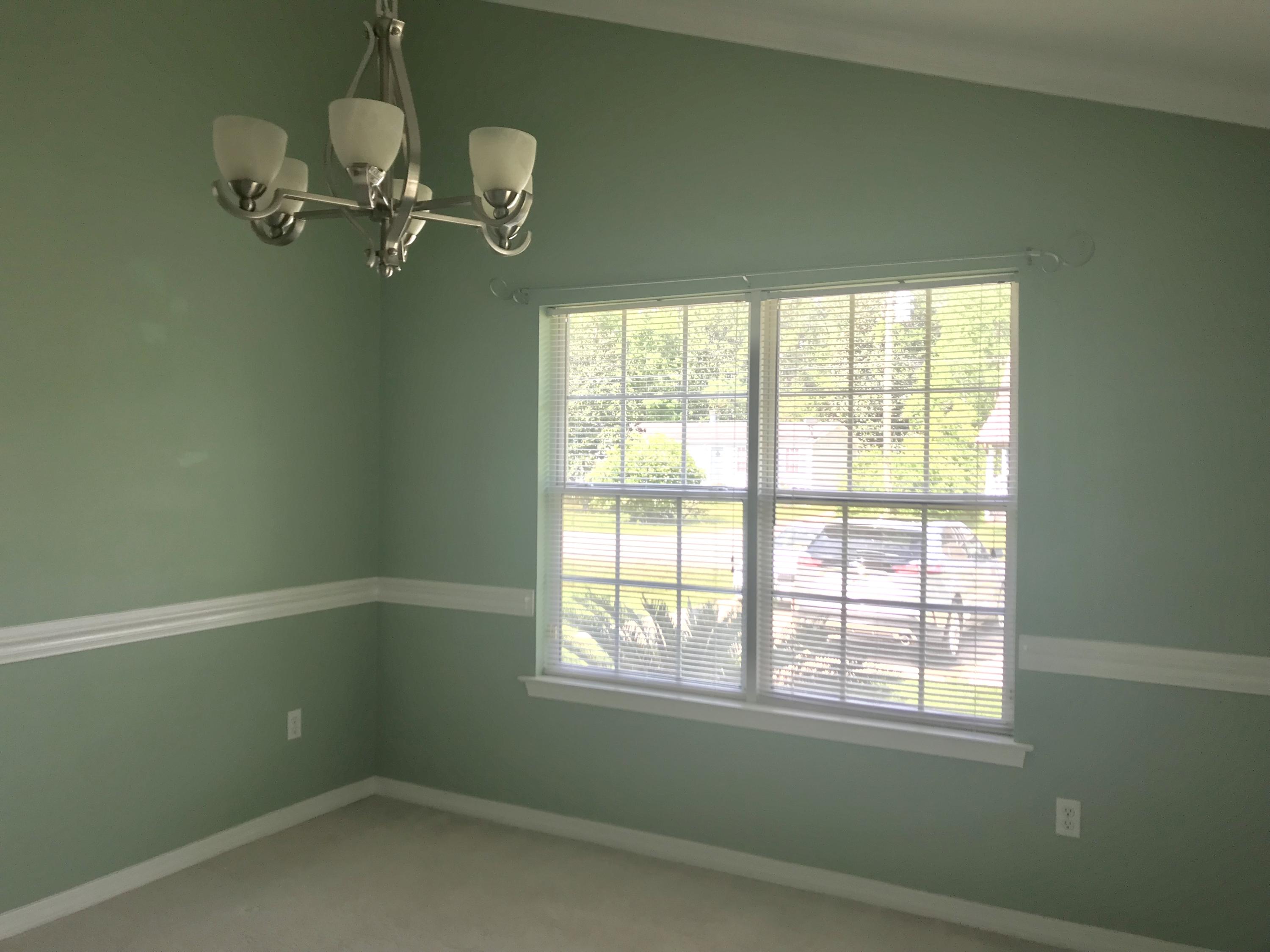 38 4th Street Santa Rosa Beach, FL 32459 - Photo 6 of 22 a view of empty room with windows and chandelier