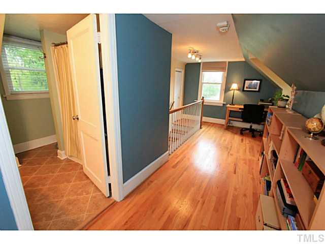 308 Colleton Road Raleigh, NC 27610 - Photo 15 of 25 a view of living room with furniture and wooden floor