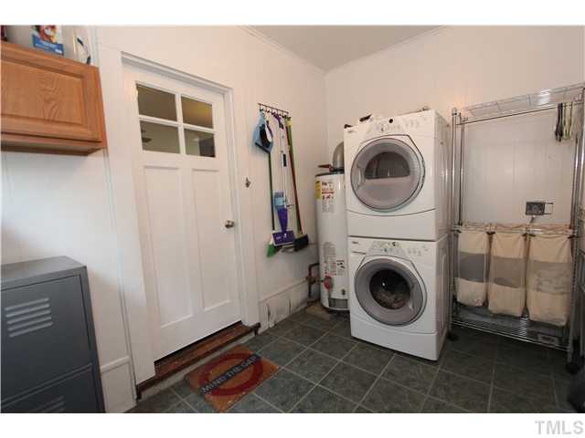 308 Colleton Road Raleigh, NC 27610 - Photo 16 of 25 a view of a hallway with washer and dryer