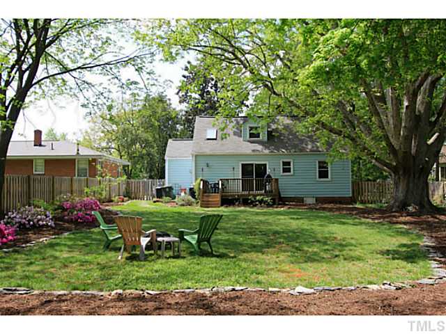 308 Colleton Road Raleigh, NC 27610 - Photo 17 of 25 a front view of a house with a garden and trees