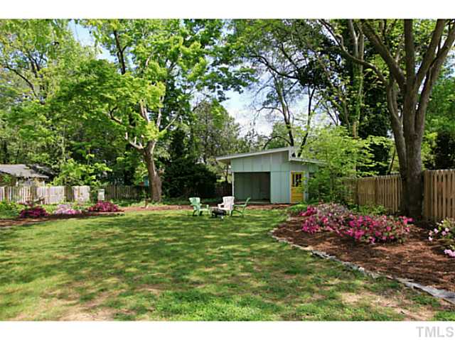 308 Colleton Road Raleigh, NC 27610 - Photo 18 of 25 a backyard of a house with table and chairs