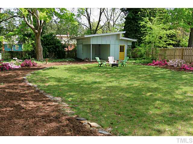 308 Colleton Road Raleigh, NC 27610 - Photo 19 of 25 a front view of a house with yard and trees