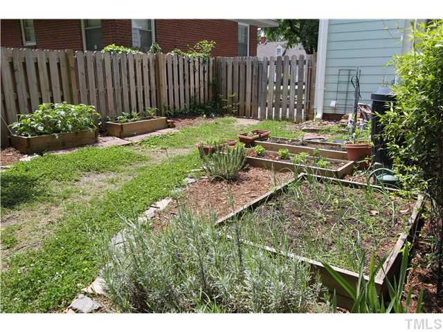 308 Colleton Road Raleigh, NC 27610 - Photo 20 of 25 a garden with wooden fence