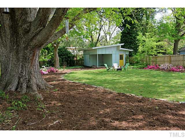 308 Colleton Road Raleigh, NC 27610 - Photo 22 of 25 a backyard of a house with table and chairs