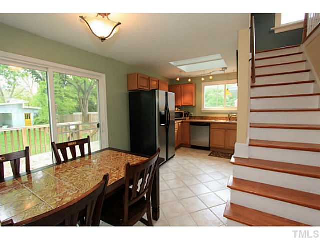 308 Colleton Road Raleigh, NC 27610 - Photo 3 of 25 a dining room with furniture and a floor to ceiling window