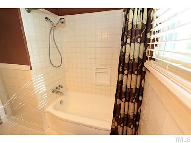 308 Colleton Road Raleigh, NC 27610 - Photo 9 of 25 a bathroom with a shower