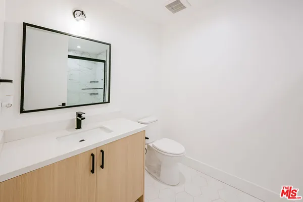 a view of a hallway with washer and dryer