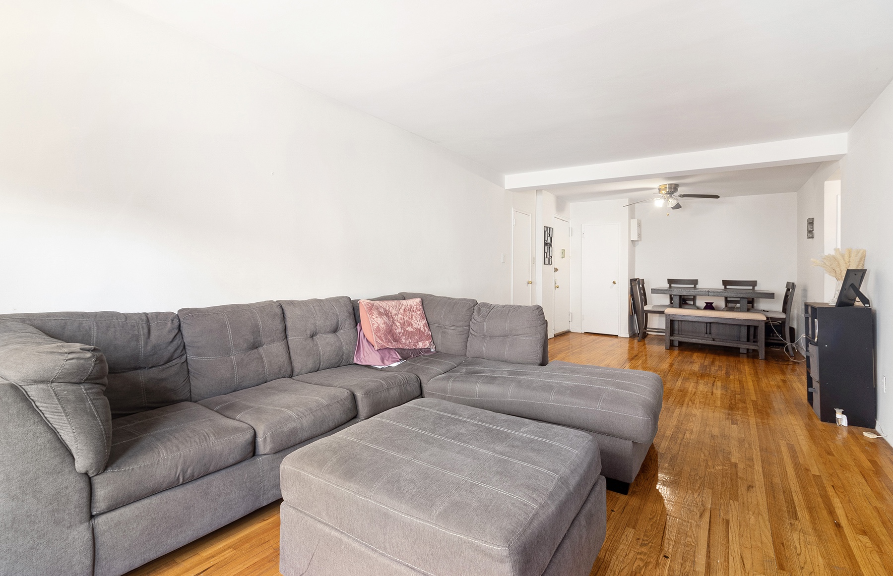 6535 Broadway, Unit 2A Bronx, NY 10471 - Photo 4 of 11 a living room with furniture and a wooden floor