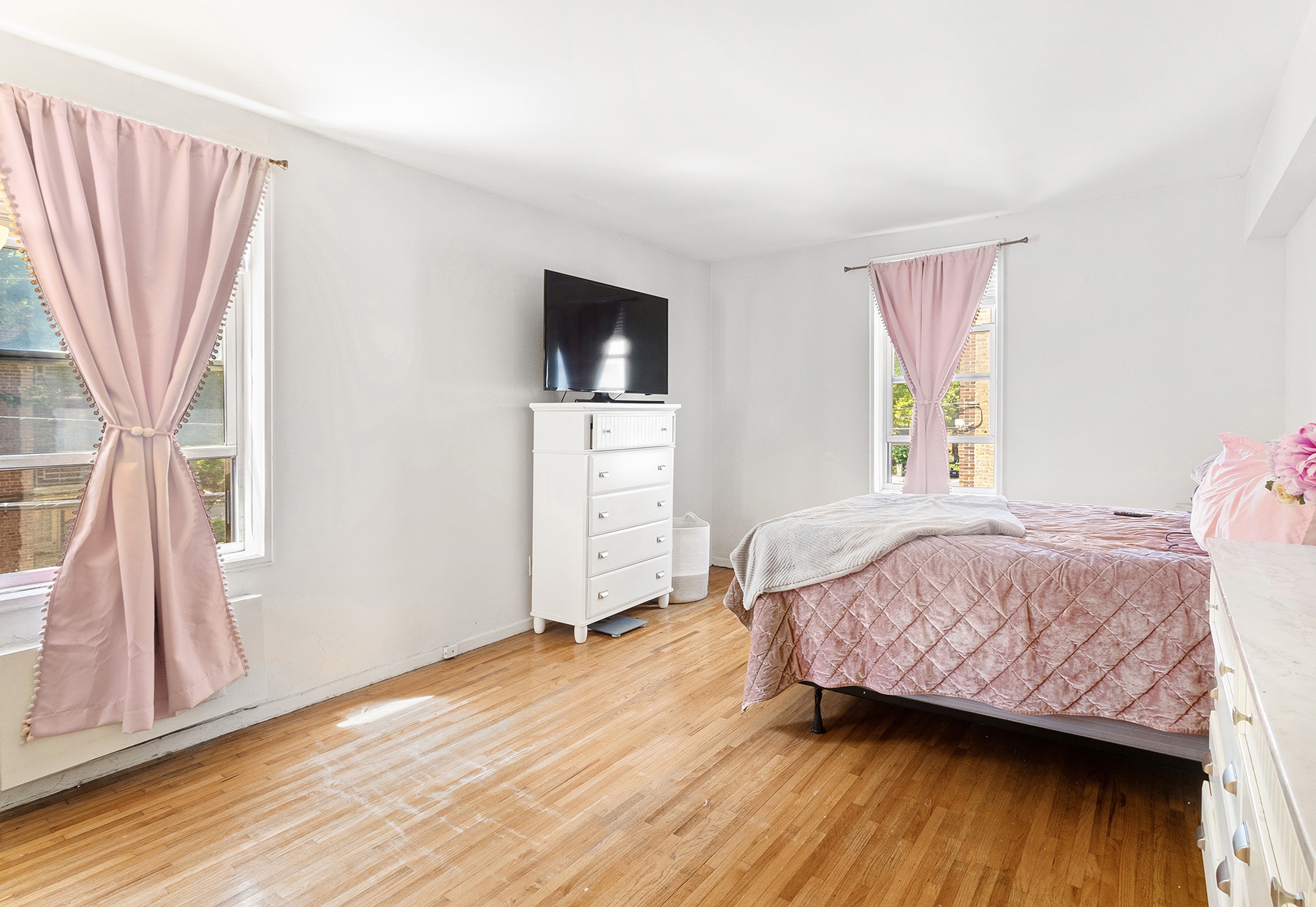 6535 Broadway, Unit 2A Bronx, NY 10471 - Photo 6 of 11 a bedroom with a bed and wooden floor