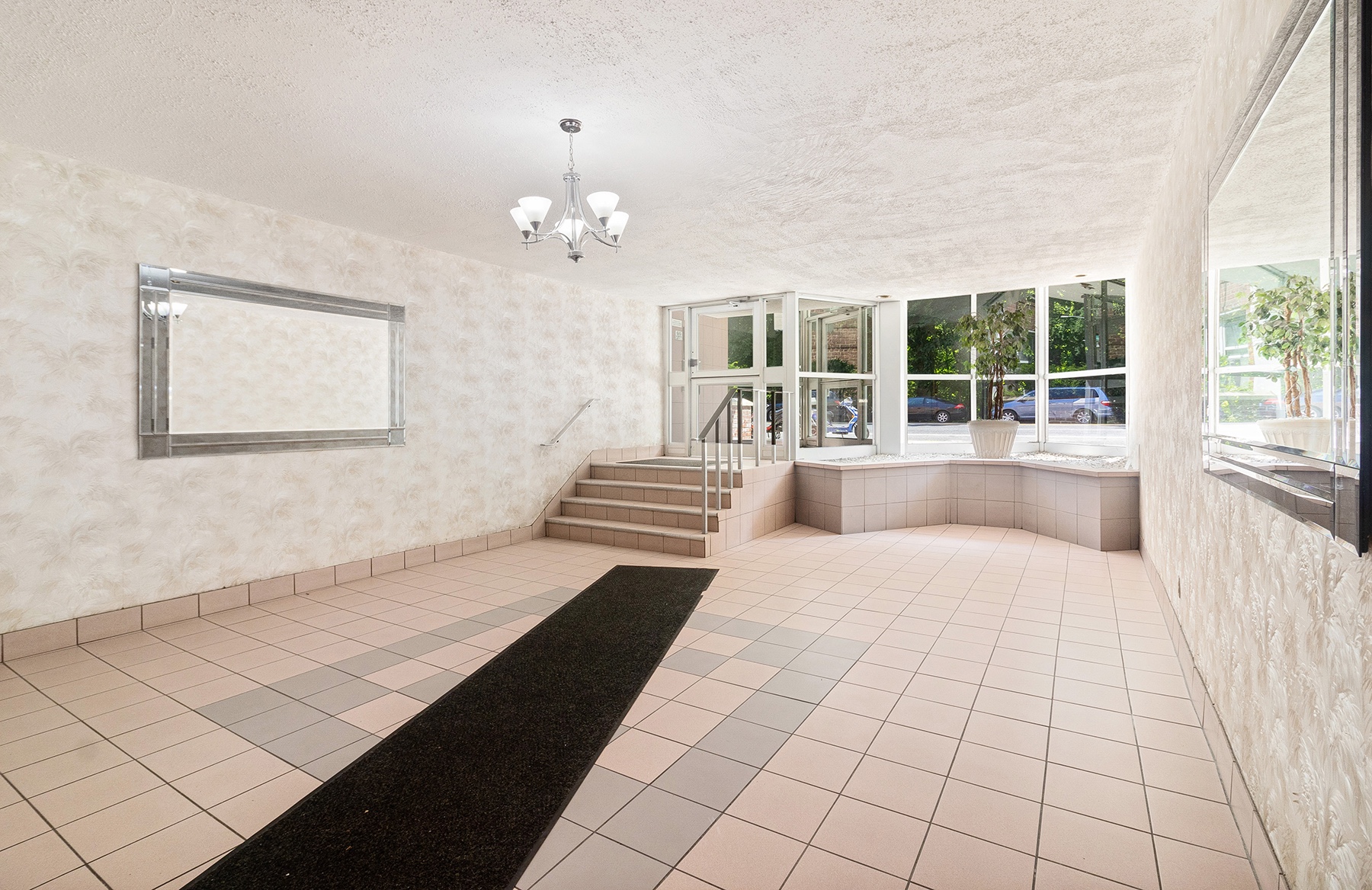 6535 Broadway, Unit 2A Bronx, NY 10471 - Photo 10 of 11 a living room with a large bed and a large window