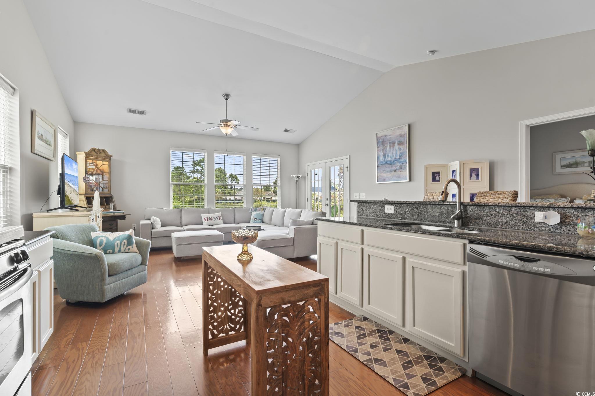 5060 Prato Loop Myrtle Beach, SC 29579 - Photo 11 of 40 Kitchen featuring dishwasher, sink, lofted ceiling