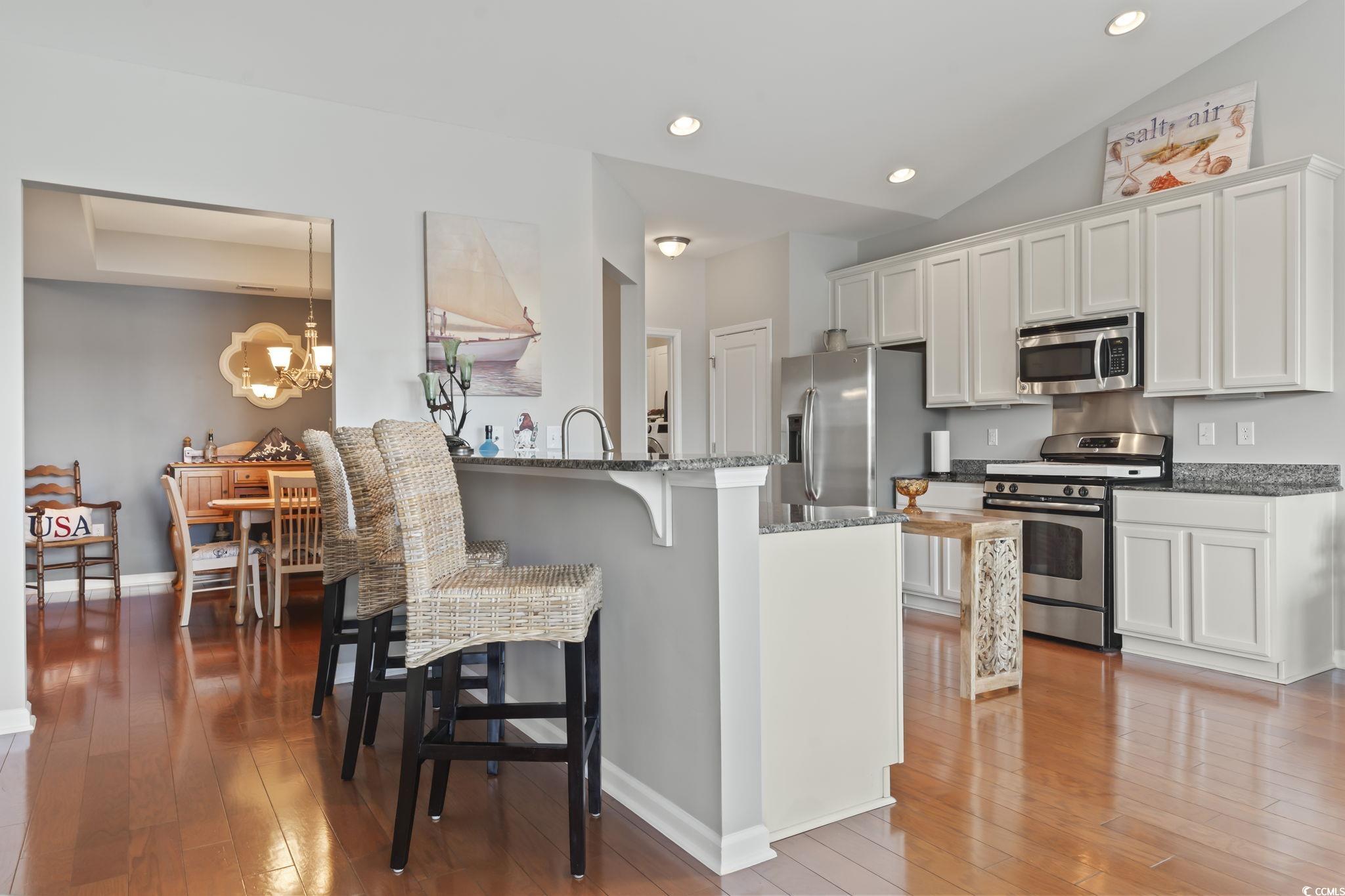 5060 Prato Loop Myrtle Beach, SC 29579 - Photo 13 of 40 Kitchen featuring vaulted ceiling, a notable chand