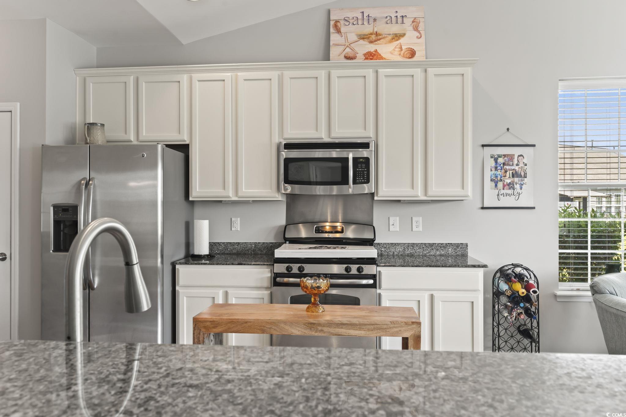 5060 Prato Loop Myrtle Beach, SC 29579 - Photo 15 of 40 Kitchen with stainless steel appliances, dark ston