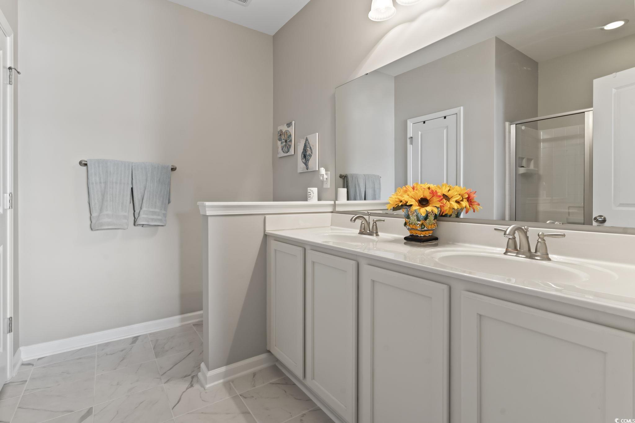 5060 Prato Loop Myrtle Beach, SC 29579 - Photo 22 of 40 Bathroom with a shower with shower door and vanity