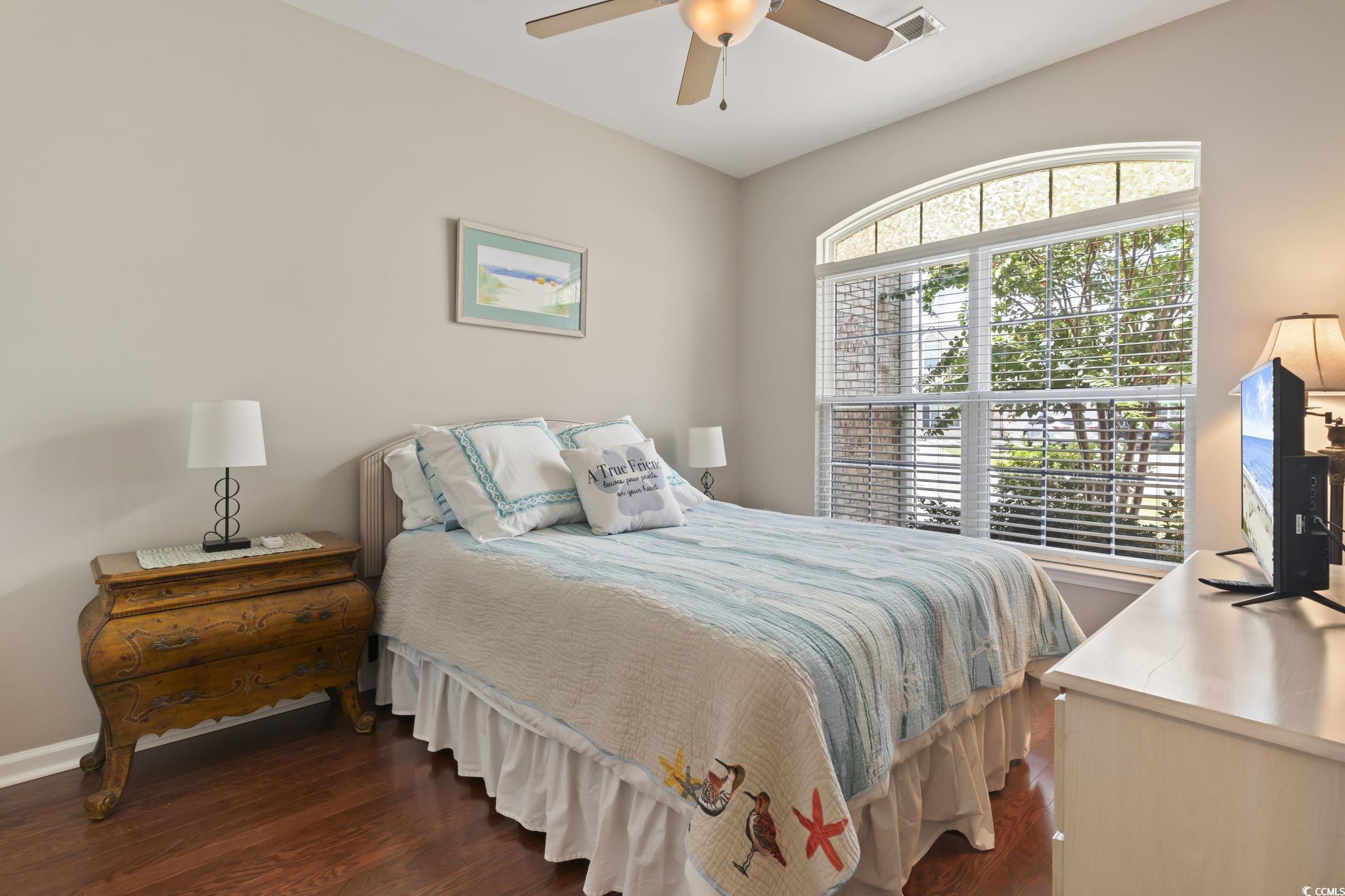 5060 Prato Loop Myrtle Beach, SC 29579 - Photo 23 of 40 Bedroom featuring dark wood-type flooring, multipl