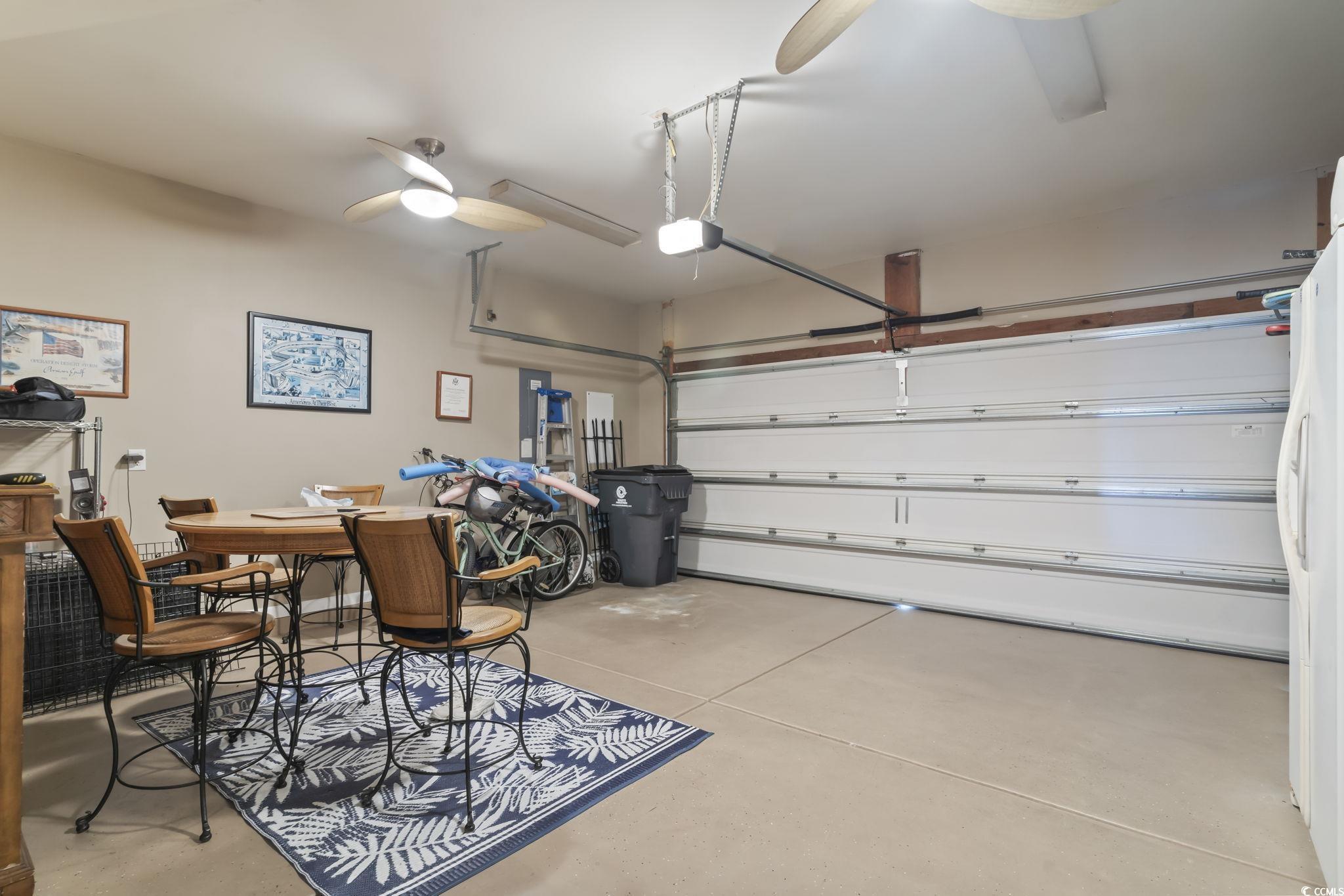 5060 Prato Loop Myrtle Beach, SC 29579 - Photo 31 of 40 Garage featuring a garage door opener and ceiling