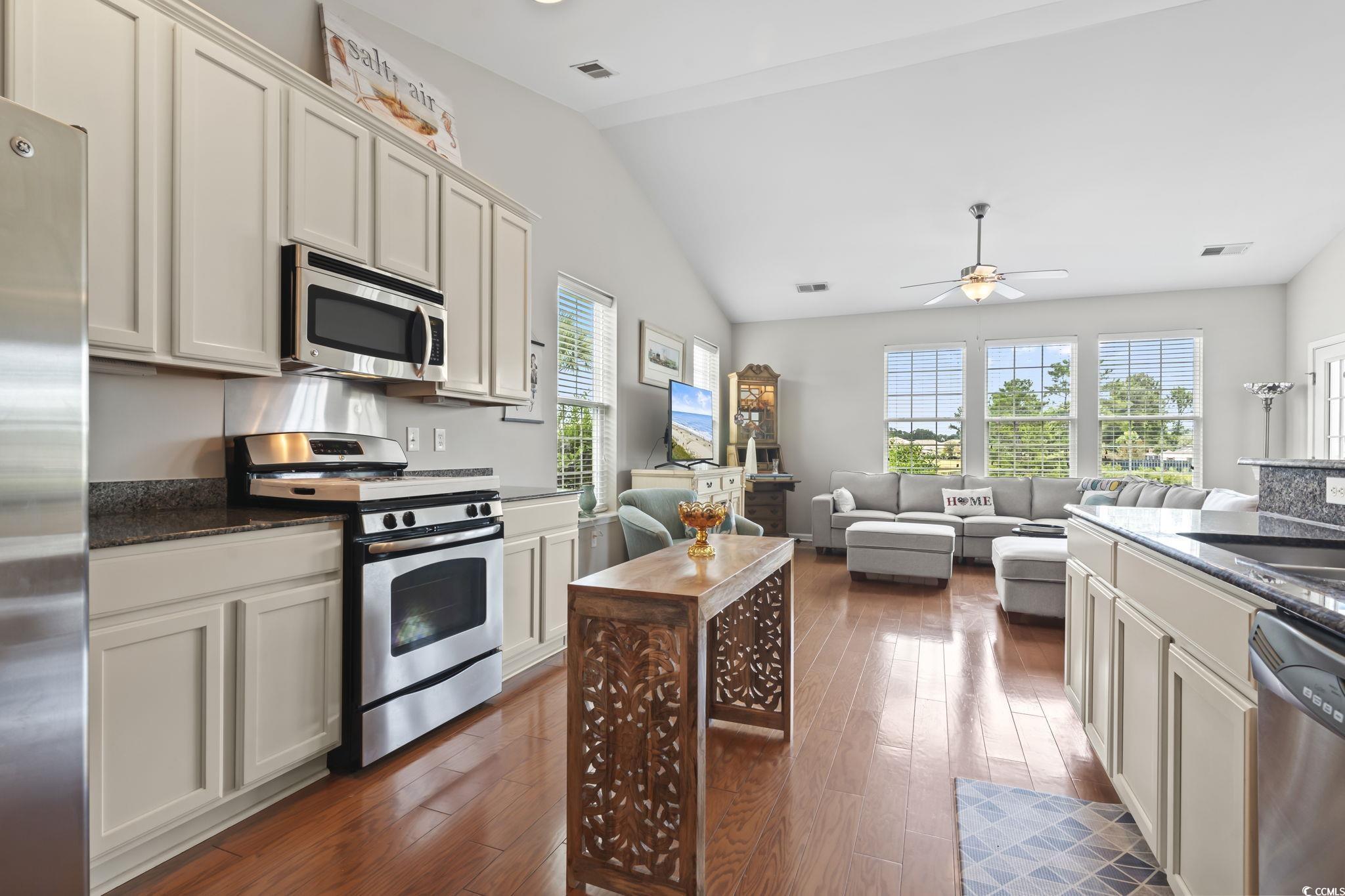 5060 Prato Loop Myrtle Beach, SC 29579 - Photo 10 of 40 Kitchen featuring dark stone countertops, applianc