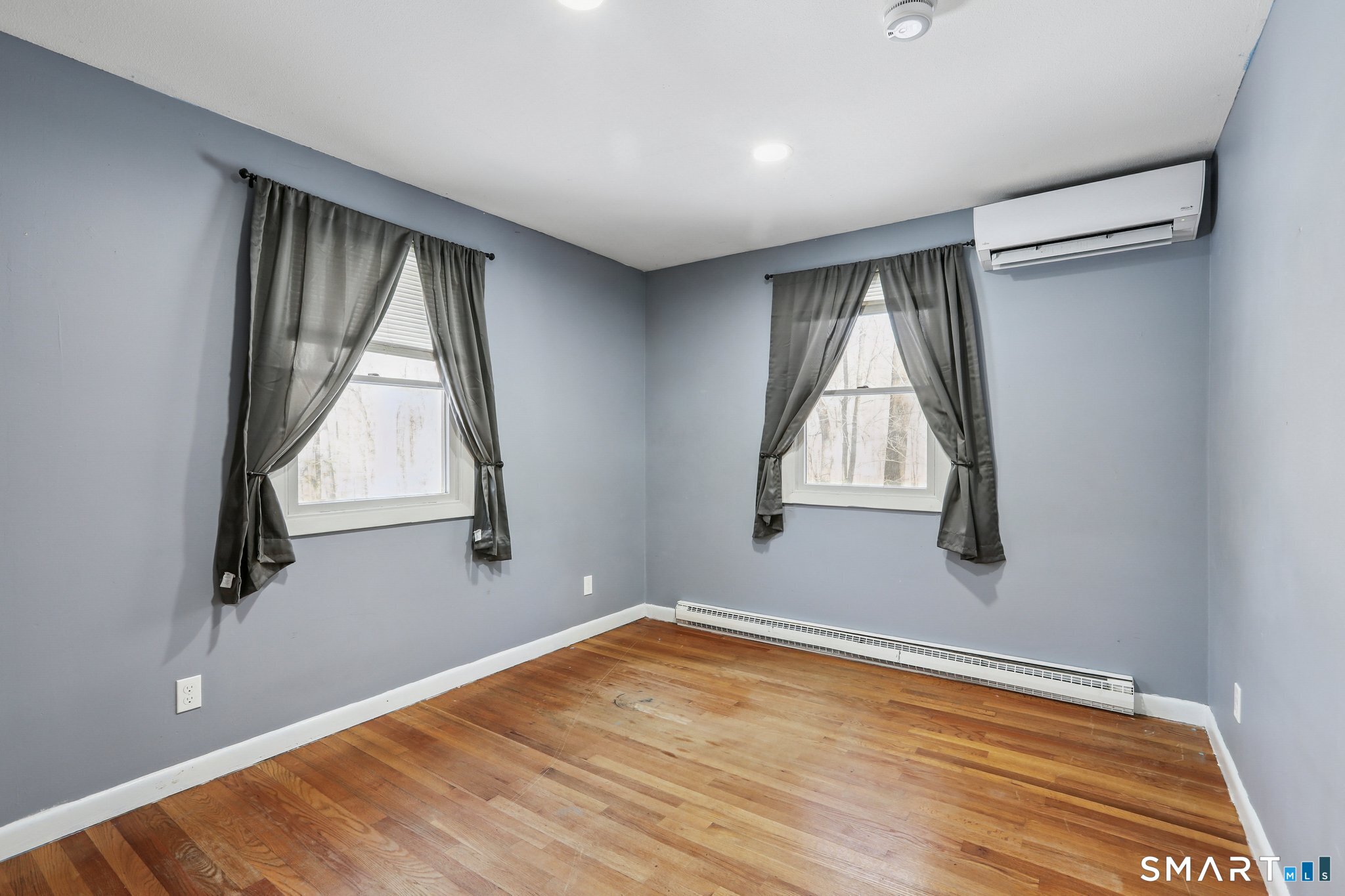 643 Bucks Hill Road Southbury, CT 06488 - Photo 14 of 25 a view of empty room with wooden floor and fan
