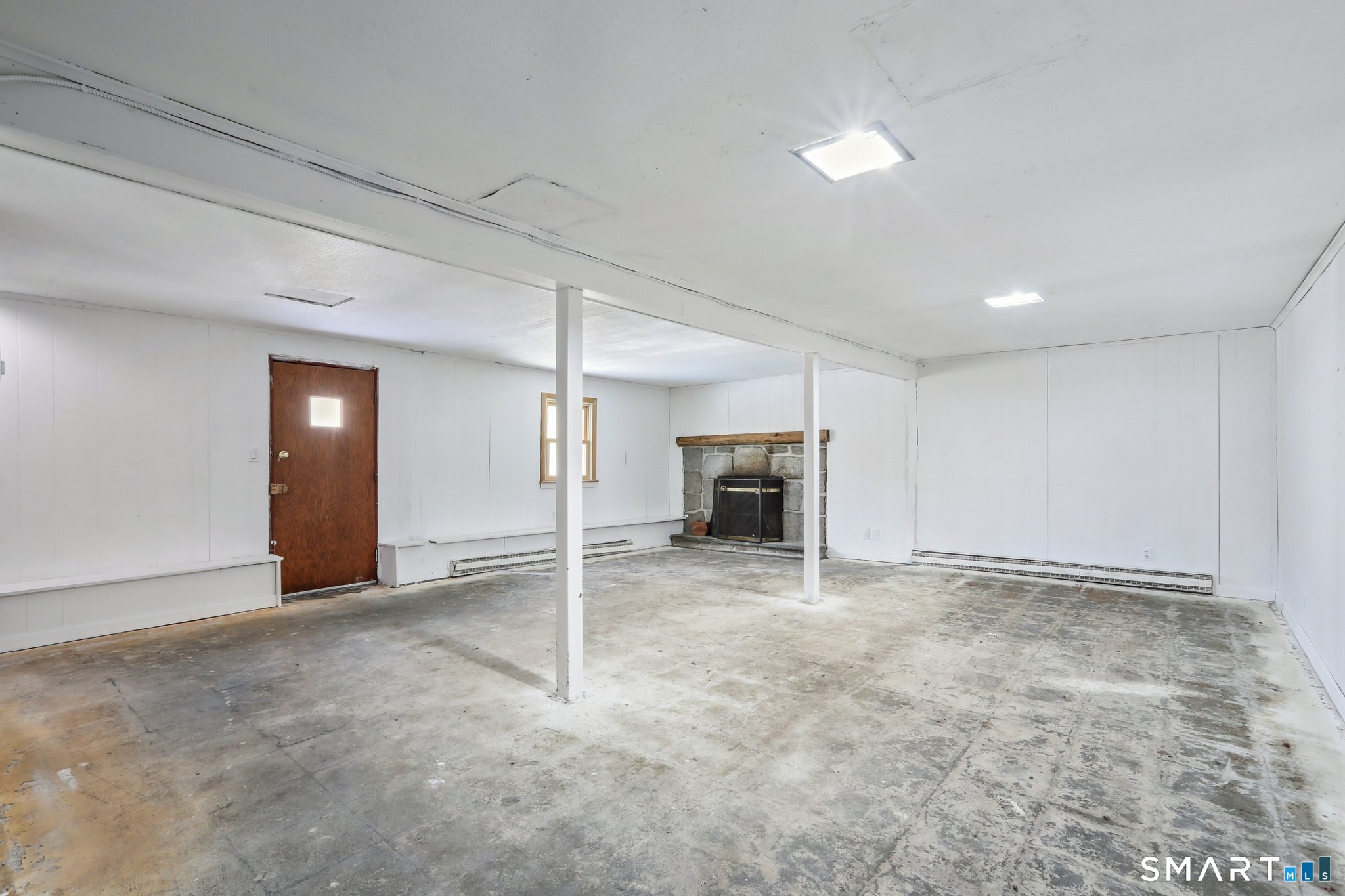 643 Bucks Hill Road Southbury, CT 06488 - Photo 19 of 25 an empty room with fireplace and a window